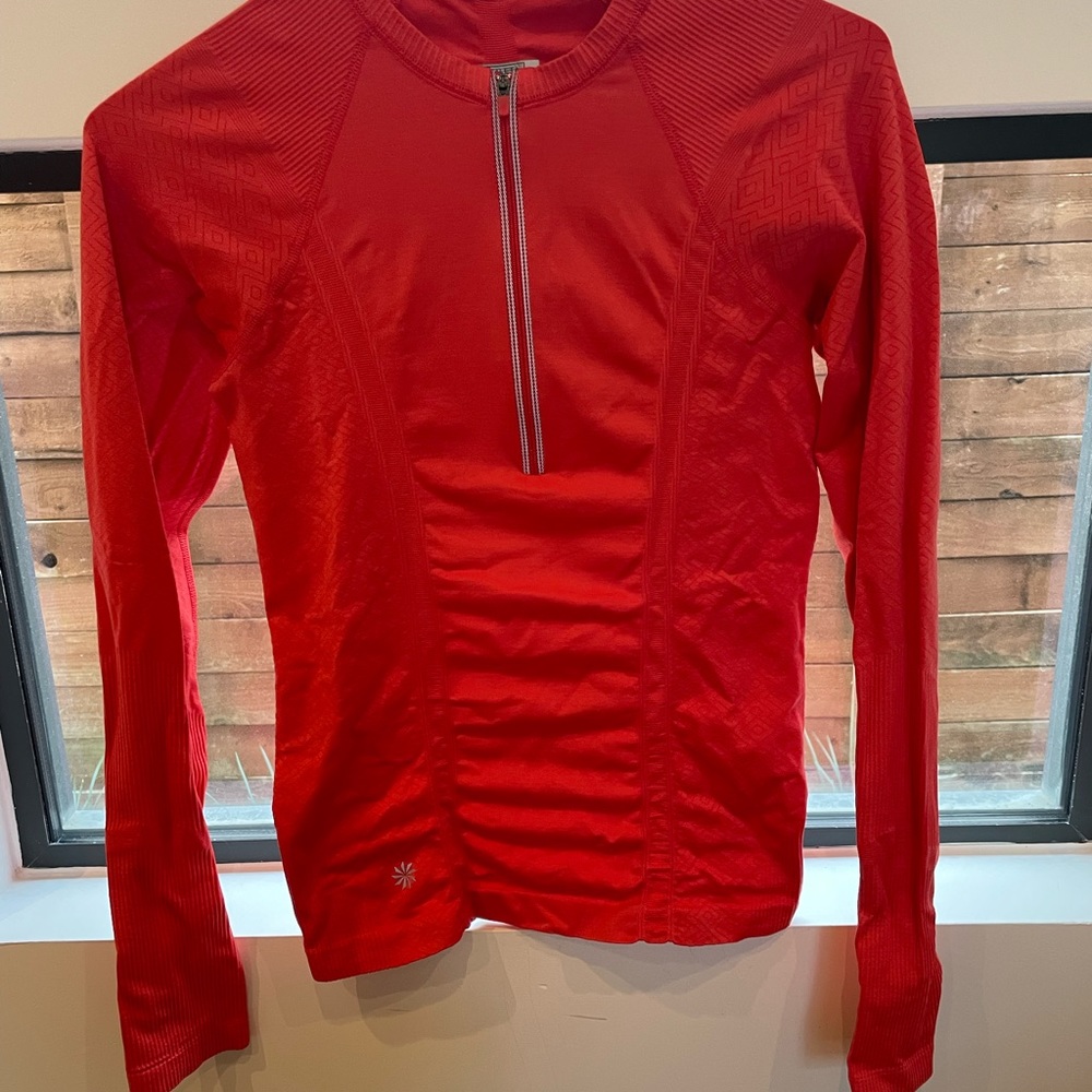 Athleta salmon orange Lycra athletic top.